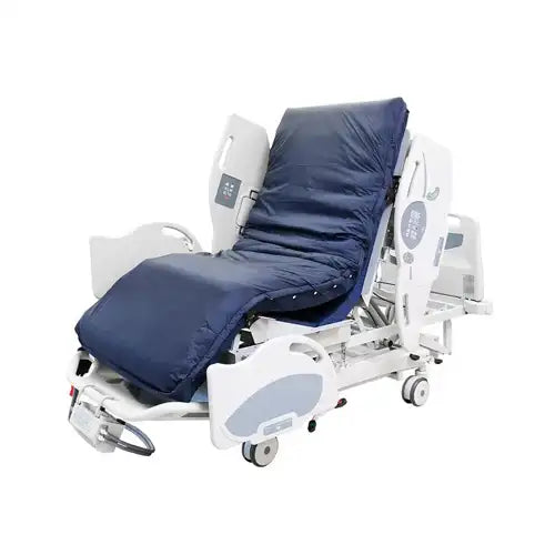 Hospital bed with a blue cover on a white background