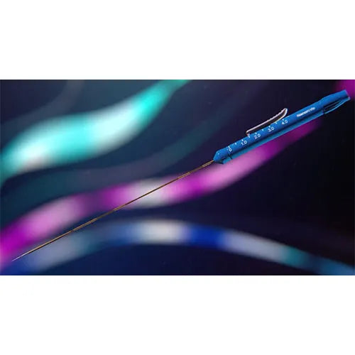 Needle with measurement scale against a colorful, blurred background