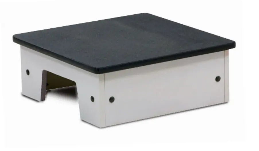 Step stool with black top and white base on a white background