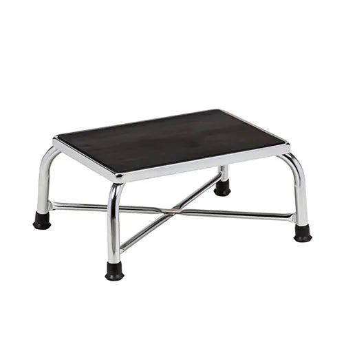 Step stool with black top and chrome frame on a white background