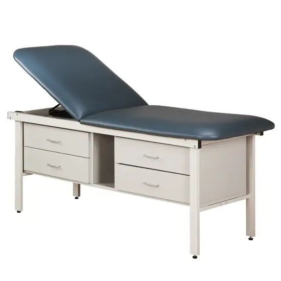 Medical examination table with blue cushioned surface and white drawers on a white background