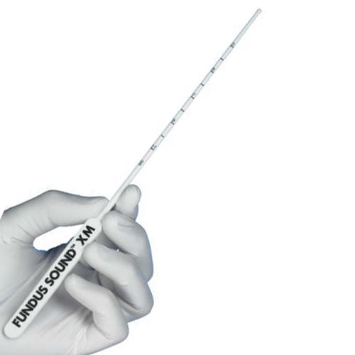 Hand holding a white medical tool labeled 'FUNDUS SOUND XM' on a white background