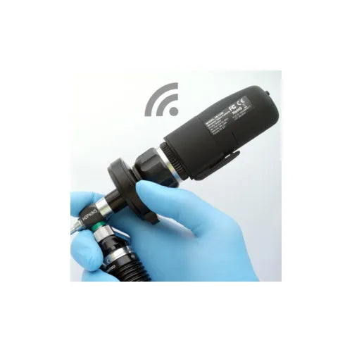 Medical device with wireless signal icon held by a gloved hand on a light gray background