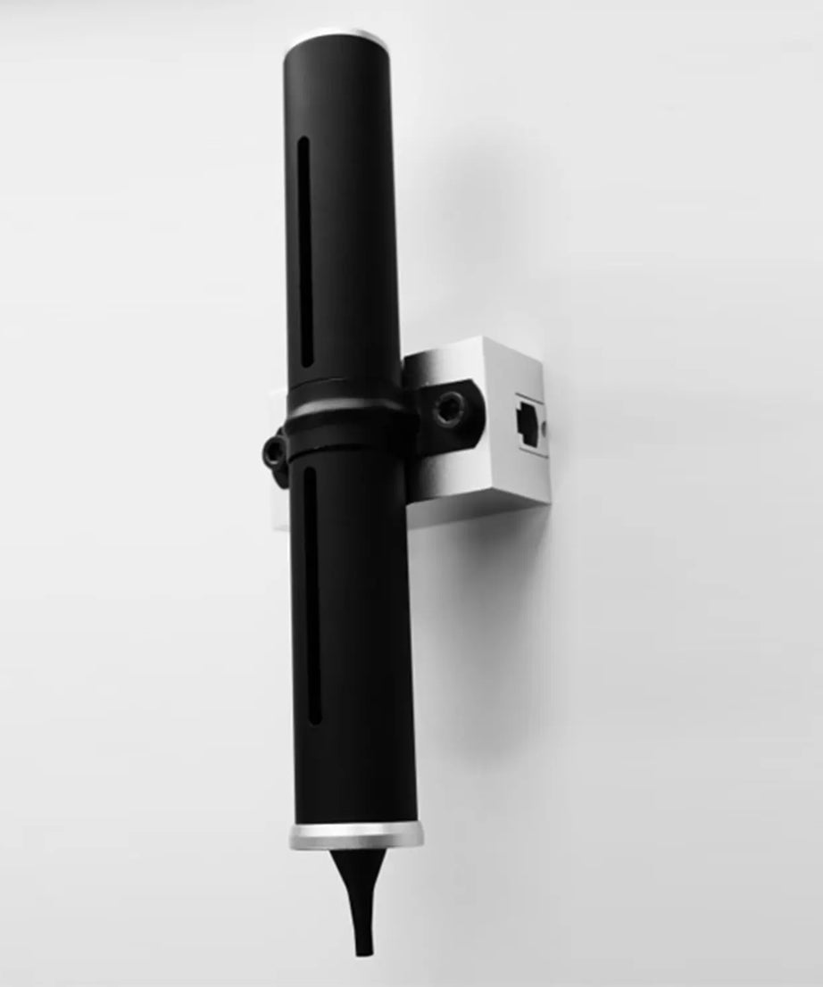 Black and silver wall-mounted device on a white background