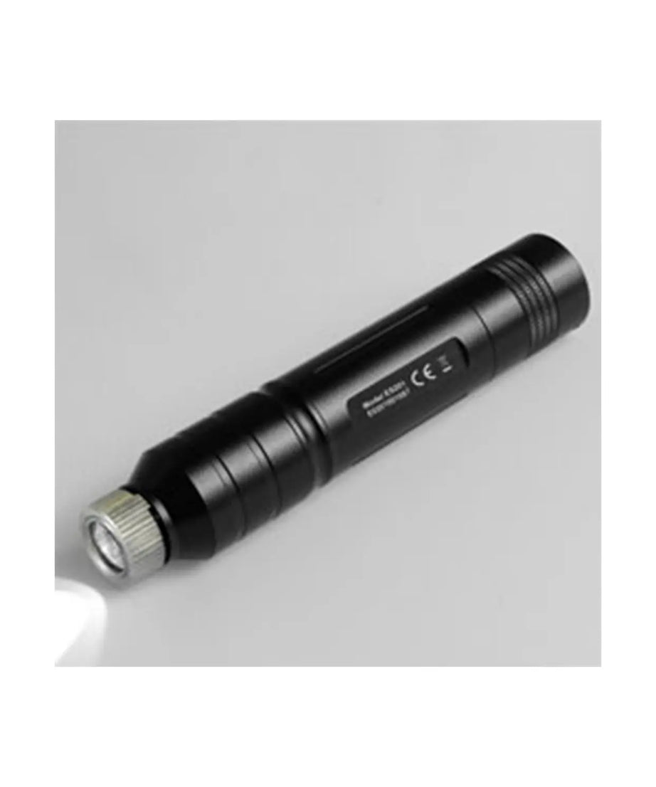 Black flashlight on a light gray background