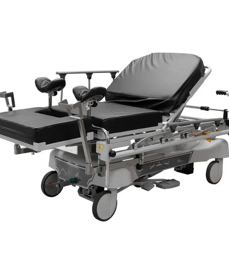 A Titan OBGYN Stretcher with leg and rest and railing up