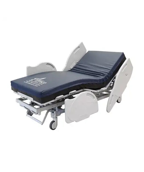 An adjustable hospital-style bed frame with a navy blue padded mattress and white side rails, shown on a plain white background.