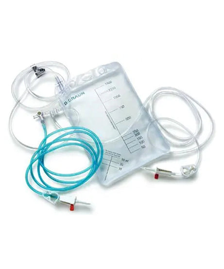 A clear plastic urine collection bag with printed measurement markings, attached to transparent tubing and a coiled light blue catheter with small red and white connectors, photographed on a white background.