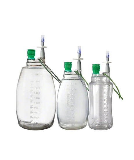 Three clear plastic measuring bags with green caps and attached tubing, shown on a plain white background.