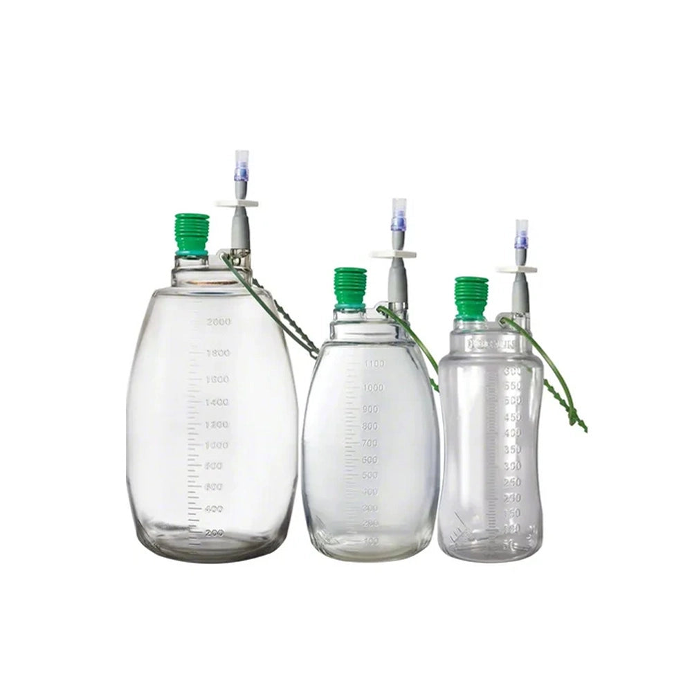 Three clear plastic measuring bags with green caps and attached tubing, shown on a plain white background.