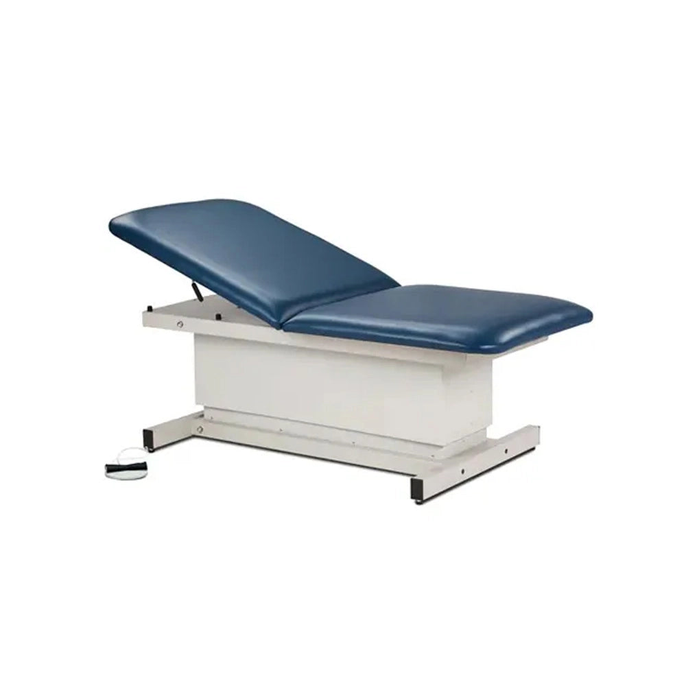 An adjustable medical examination table with a dark blue padded top and a white metal base, shown on a plain white background.