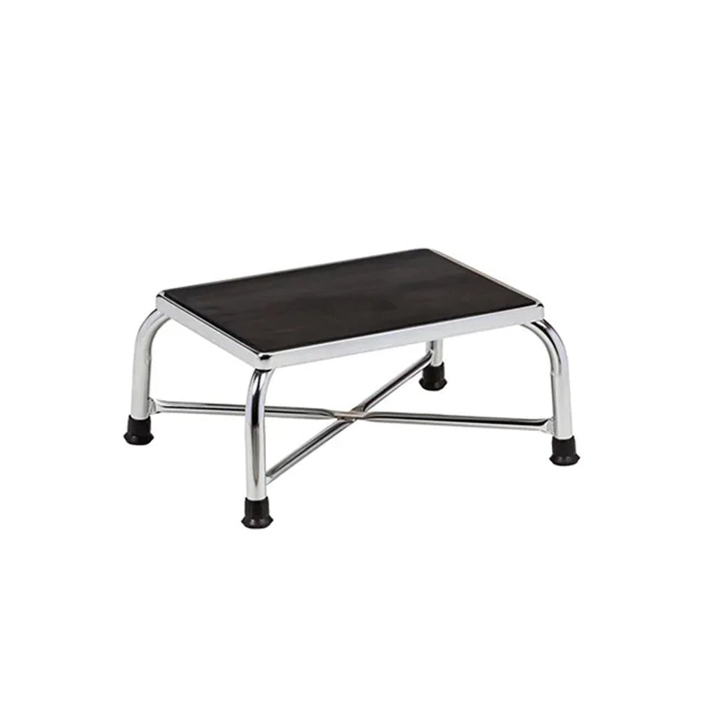 A small step stool with a black rectangular seat and a chrome metal frame with black rubber feet, shown on a plain white background.