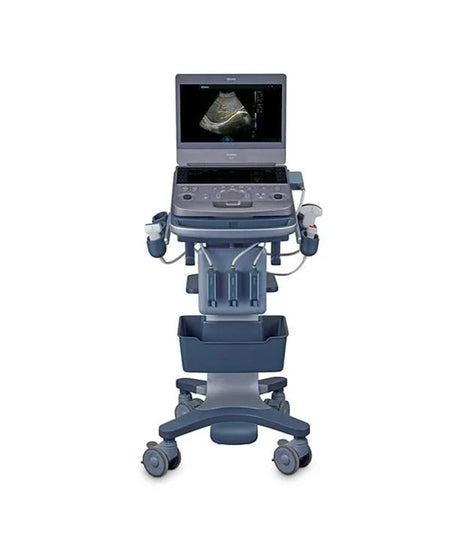 A medical ultrasound machine on a wheeled cart stand, shown from the front against a plain white background. The machine is dark gray with blue-gray accents and has an ultrasound image displayed on the screen.