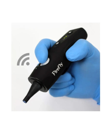 A black handheld electronic device labeled 'Firefly' being held by a hand wearing a blue nitrile glove, with a gray wireless signal icon on the left, set against a plain white background.